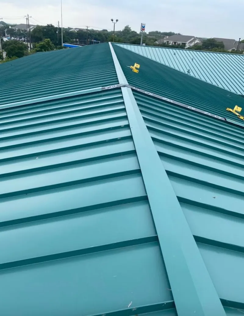 Green commercial metal roof ridge and valley for Metal Roof Repair in Lisbon